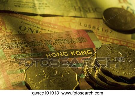 Close-up of coins on paper currency View Large Photo Image Stock Image - Close-up of coins on paper currency. Fotosearch