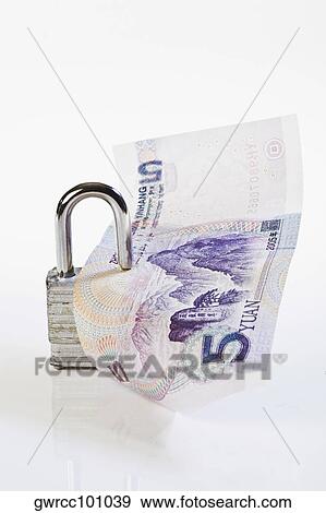Lock with a Chinese Yuan note View Large Photo Image Stock Photo - Lock with a Chinese Yuan note. Fotosearch