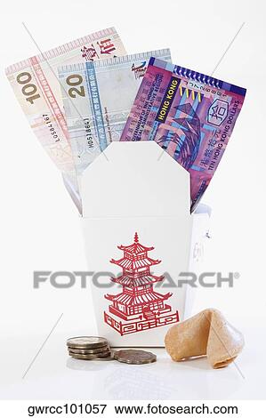 Paper currency in a donation box with coins and fortune cookie View Large Photo Image Stock Photo - Paper currency in a donation box with coins and fortune cookie. Fotosearch