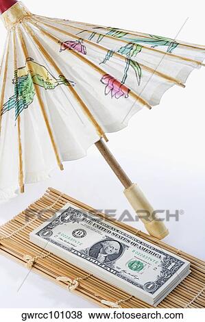 US paper currency covered with parasol View Large Photo Image Stock Photo - US paper currency covered with parasol. Fotosearch