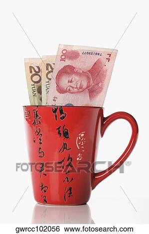 Chinese Yuan notes in a cup View Large Photo Image Stock Photograph - Chinese Yuan notes in a cup. Fotosearch