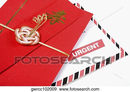 Close-up of a Chinese red envelope with a correspondence View Large Photo Image Stock Photo - Close-up of a Chinese red envelope with a correspondence. Fotosearch