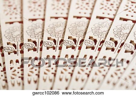 Close-up of a folding fan View Large Photo Image Stock Photograph - Close-up of a folding fan. Fotosearch