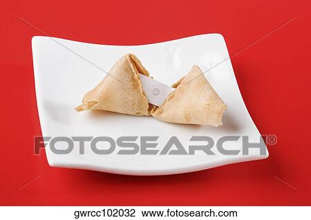 Close-up of a fortune cookie in a tray View Large Photo Image Stock Image - Close-up of a fortune cookie in a tray. Fotosearch