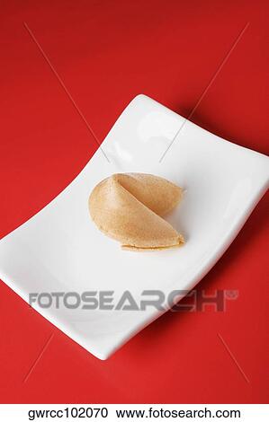 Close-up of a fortune cookie in a tray View Large Photo Image Stock Image - Close-up of a fortune cookie in a tray. Fotosearch