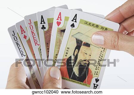 Close-up of a person's hands playing cards View Large Photo Image Stock Image - Close-up of a person's hands playing cards. Fotosearch