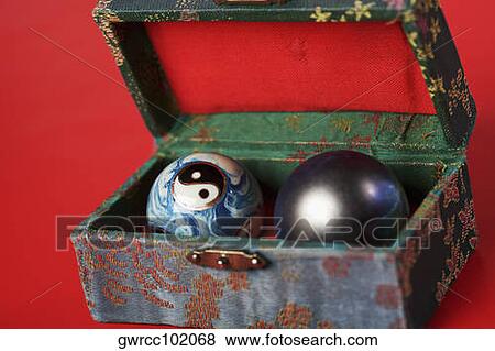 Close-up of a yin yang ball with a qigong ball in a box View Large Photo Image Stock Photo - Close-up of a yin yang ball with a qigong ball in a box. Fotosearch