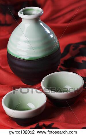 Close-up of two bowls with a jar View Large Photo Image Stock Image - Close-up of two bowls with a jar. Fotosearch