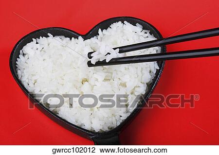 Frying pan of white rice with chopsticks View Large Photo Image Stock Image - Frying pan of white rice with chopsticks. Fotosearch
