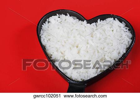 White rice in a heart shape frying pan View Large Photo Image Stock Image - White rice in a heart shape frying pan. Fotosearch