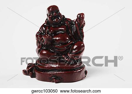 Close-up of a figurine of Laughing Buddha against white background View Large Photo Image Stock Image - Close-up of a figurine of Laughing Buddha against white background. Fotosearch
