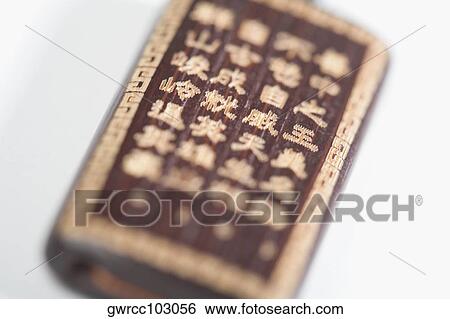 Close-up of a good luck Chinese hand carved bamboo View Large Photo Image Stock Photograph - Close-up of a good luck Chinese hand carved bamboo. Fotosearch