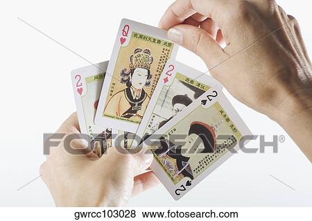 Close-up of a person's hands playing cards View Large Photo Image Stock Photo - Close-up of a person's hands playing cards. Fotosearch