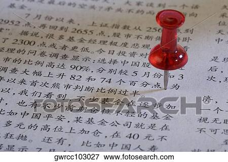 Close-up of a straight pin on a financial newspaper View Large Photo Image Stock Photo - Close-up of a straight pin on a financial newspaper. Fotosearch