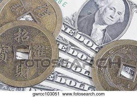 Close-up of Chinese coins on paper currency View Large Photo Image Stock Image - Close-up of Chinese coins on paper currency. Fotosearch