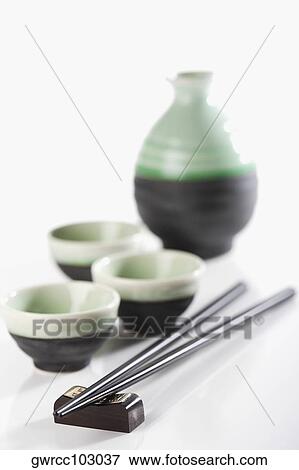 Close-up of chopsticks with bowls View Large Photo Image Stock Photo - Close-up of chopsticks with bowls. Fotosearch
