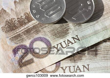 Close-up of coins on Chinese paper currency View Large Photo Image Stock Photo - Close-up of coins on Chinese paper currency. Fotosearch