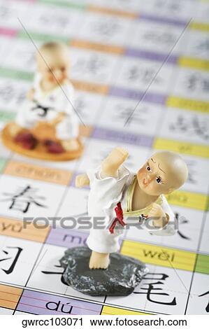 Close-up of two figurines View Large Photo Image Stock Image - Close-up of two figurines. Fotosearch
