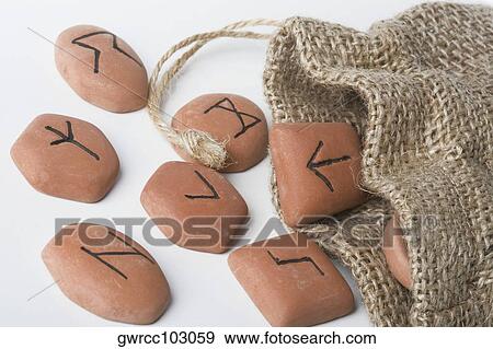 Close-up of Viking future divination stones spilling out of a bag View Large Photo Image Stock Photo - Close-up of Viking future divination stones spilling out of a bag. Fotosearch