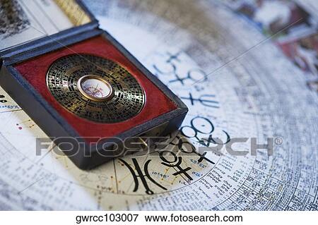 Feng shui compass over a Chinese calendar View Large Photo Image Stock Photo - Feng shui compass over a Chinese calendar. Fotosearch