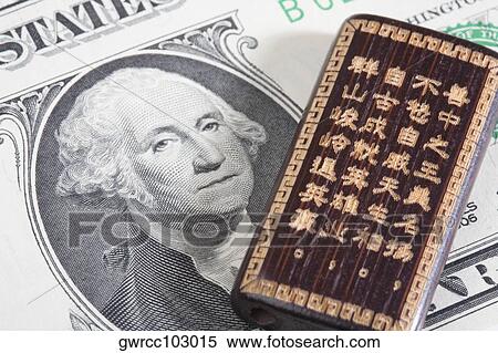 Good luck Chinese hand carved bamboo on a US paper currency View Large Photo Image Stock Photography - Good luck Chinese hand carved bamboo on a US paper currency. Fotosearch
