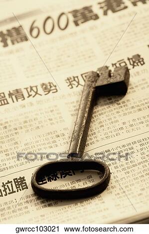 Key on a newspaper View Large Photo Image Stock Image - Key on a newspaper. Fotosearch
