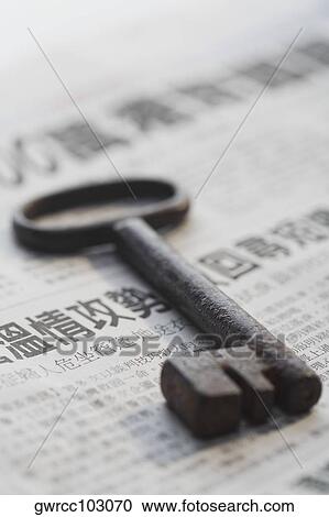 Key on a newspaper View Large Photo Image Stock Image - Key on a newspaper. Fotosearch