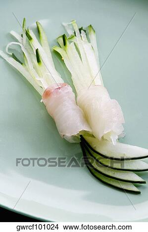 Picture - Ajoporro with rolled fish served in a plate. Fotosearch