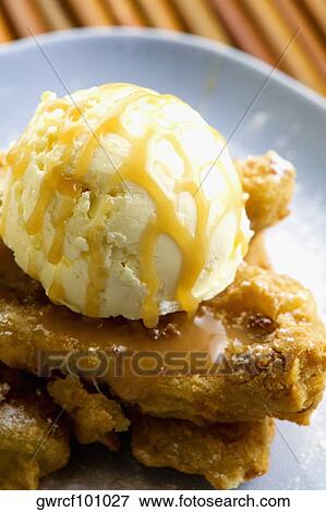 Close-up of a banana fritter served in a plate View Large Photo Image Stock Photo - Close-up of a banana fritter served in a plate. Fotosearch