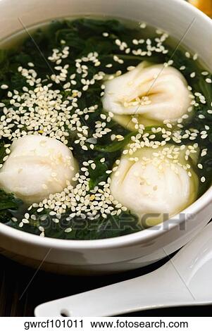 Stock Image - Close-up of Chinese dumplings in a bowl. Fotosearch