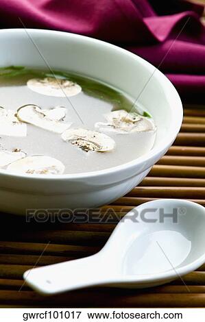 Close-up of clear broth with mushrooms in a bowl View Large Photo Image Stock Photo - Close-up of clear broth with mushrooms in a bowl. Fotosearch