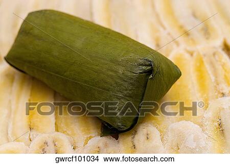Close-up of rice dumpling on banana slices View Large Photo Image Picture - Close-up of rice dumpling on banana slices. Fotosearch