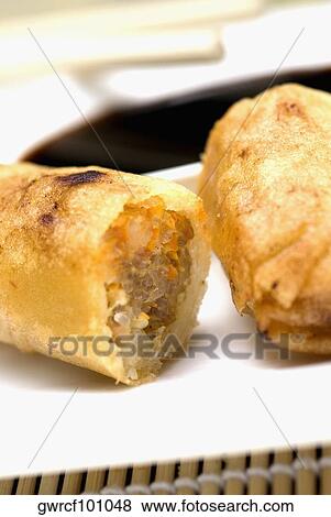 Close-up of spring rolls served in a tray View Large Photo Image Stock Photo - Close-up of spring rolls served in a tray. Fotosearch