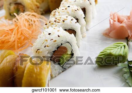 Close-up of sushi served in a tray View Large Photo Image Stock Image - Close-up of sushi served in a tray. Fotosearch
