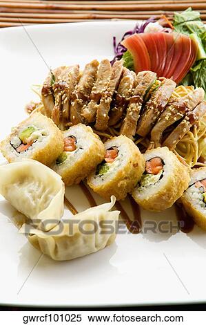 Close-up of sushi with Chinese dumplings served in a tray View Large Photo Image Stock Photography - Close-up of sushi with Chinese dumplings served in a tray. Fotosearch