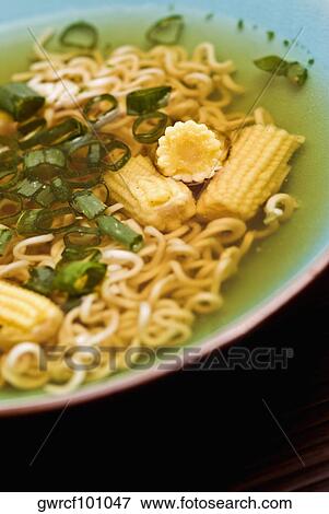Noodles and corns in a bowl View Large Photo Image Stock Photo - Noodles and corns in a bowl. Fotosearch