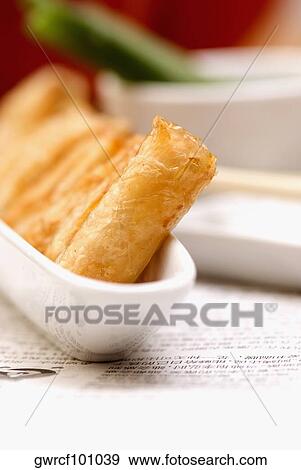 Spring rolls in a bowl View Large Photo Image Stock Photo - Spring rolls in a bowl. Fotosearch
