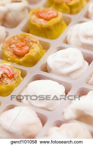 Sushi rolls with Chinese dumplings served in a tray View Large Photo Image Stock Photo - Sushi rolls with Chinese dumplings served in a tray. Fotosearch