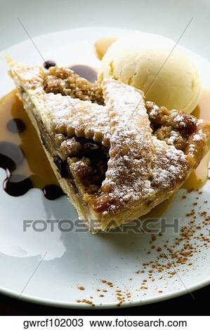 Close-up of ice-cream with tart served in a plate View Large Photo Image Stock Image - Close-up of ice-cream with tart served in a plate. Fotosearch