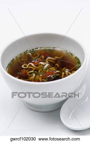 Close-up of noodles in a bowl View Large Photo Image Stock Image - Close-up of noodles in a bowl. Fotosearch