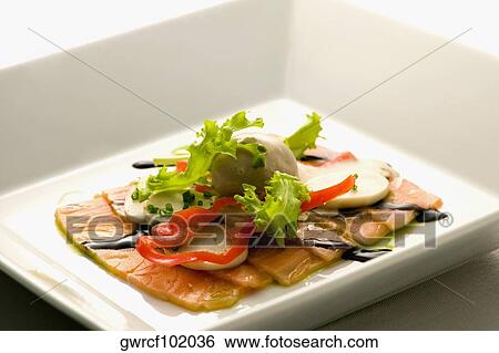 Close-up of salmon dish with palmito and soy sauce View Large Photo Image Stock Photograph - Close-up of salmon dish with palmito and soy sauce. Fotosearch