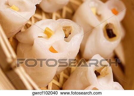 Close-up of sushi rolls served in a wicker plate View Large Photo Image Stock Image - Close-up of sushi rolls served in a wicker plate. Fotosearch