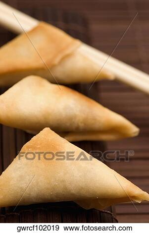 Close-up of vegetarian samosas View Large Photo Image Stock Photo - Close-up of vegetarian samosas. Fotosearch