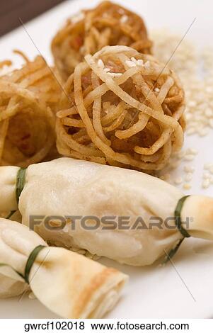 Shrimp balls wrapped in rice noodles and served with sushi View Large Photo Image Stock Photo - Shrimp balls wrapped in rice noodles and served with sushi. Fotosearch