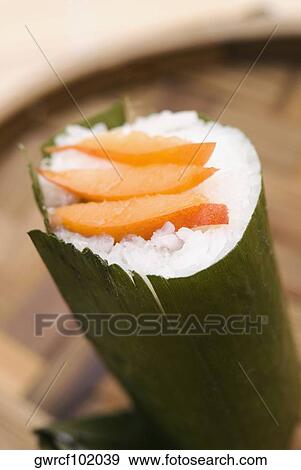 Shrimp slices on rice dumplings wrapped in banana leaves View Large Photo Image Stock Photo - Shrimp slices on rice dumplings wrapped in banana leaves. Fotosearch
