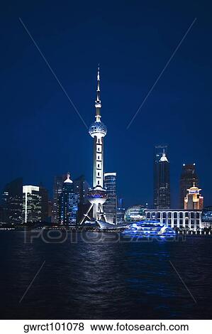 Stock Photo - Buildings at the waterfront, Oriental Pearl Tower, Huangpu River, Lujiazui, The Bund, Shanghai, China. Fotosearch