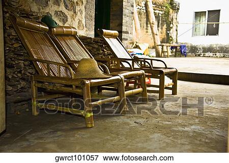 Empty chair in a house, Li River, XingPing, Yangshuo, Guangxi Province, China View Large Photo Image Stock Photo - Empty chair in a house, Li River, XingPing, Yangshuo, Guangxi Province, China. Fotosearch