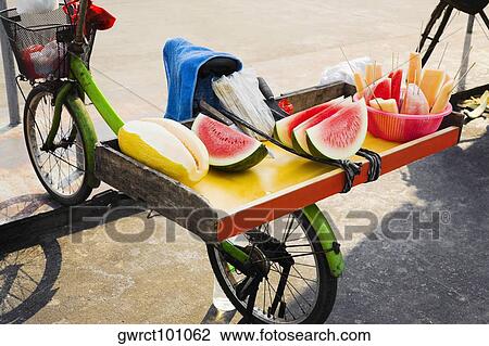 Fruits on a bicycle, Shamian Island, Guangzhou, Guangdong Province, China View Large Photo Image Stock Image - Fruits on a bicycle, Shamian Island, Guangzhou, Guangdong Province, China. Fotosearch