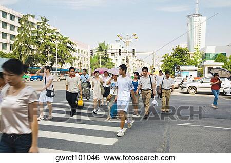 Group of people crossing the road, Hefei, Anhui Province, China View Large Photo Image Stock Photograph - Group of people crossing the road, Hefei, Anhui Province, China. Fotosearch