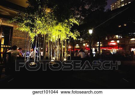 Group of people sitting at a sidewalk cafe, Xintiandi, Shanghai, China View Large Photo Image Picture - Group of people sitting at a sidewalk cafe, Xintiandi, Shanghai, China. Fotosearch